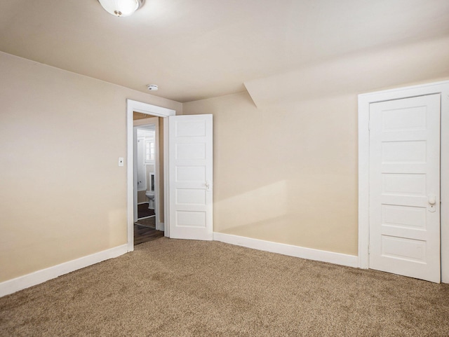 unfurnished room featuring carpet floors