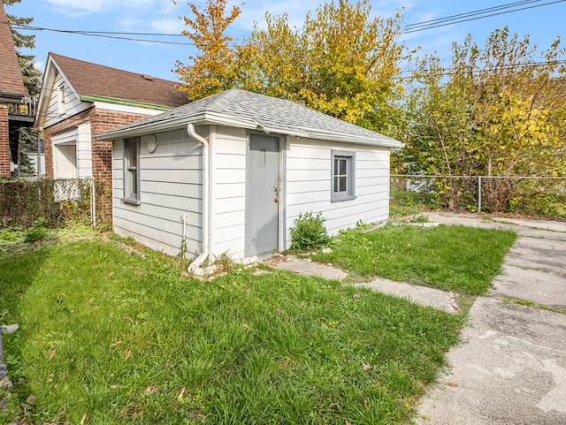 view of outbuilding featuring a yard