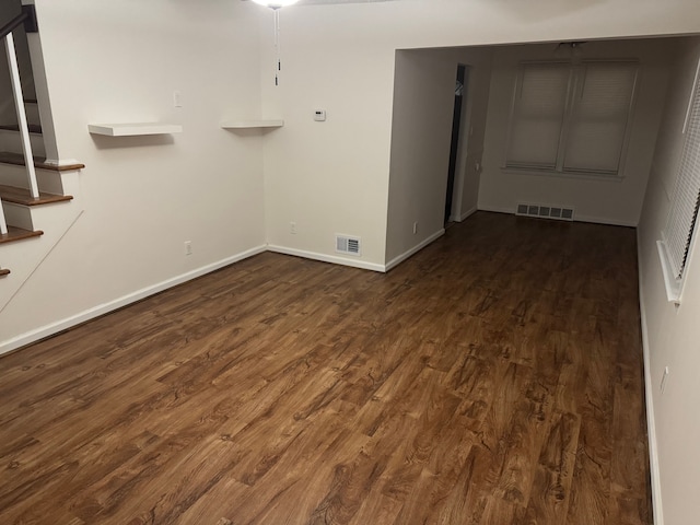 spare room with dark hardwood / wood-style flooring