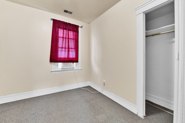 unfurnished bedroom featuring a closet and carpet