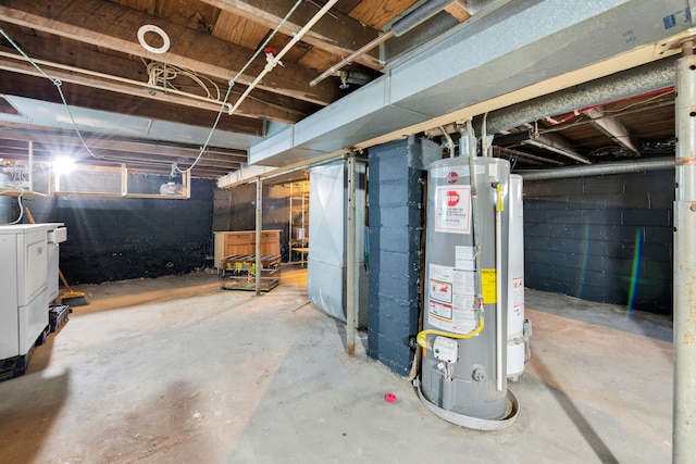 basement featuring washer / clothes dryer and water heater