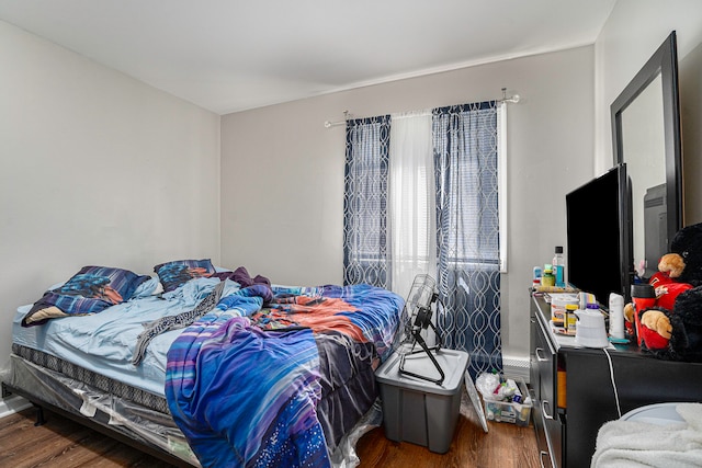 bedroom featuring dark hardwood / wood-style floors