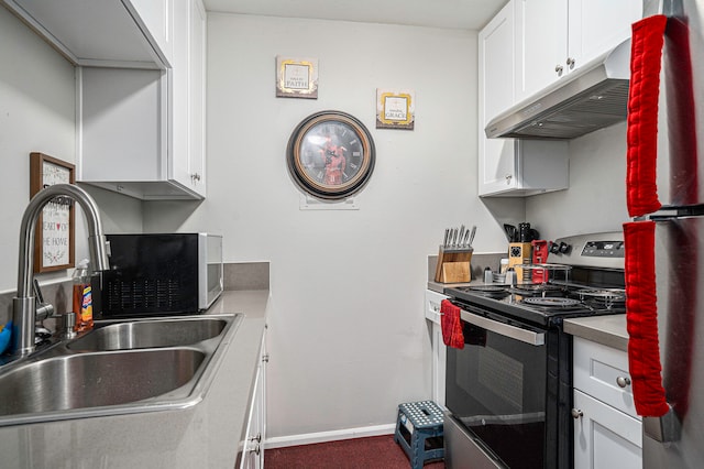 kitchen featuring white cabinetry, sink, and appliances with stainless steel finishes