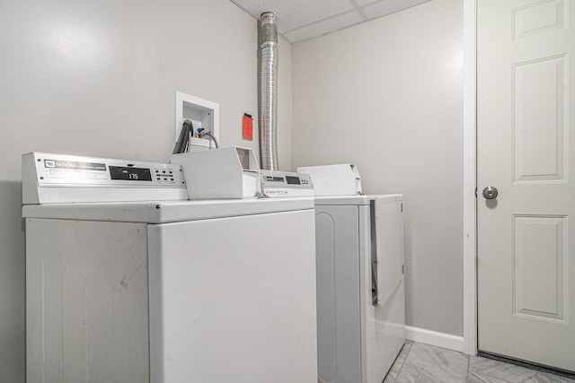 clothes washing area with independent washer and dryer