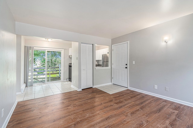 spare room featuring light hardwood / wood-style floors