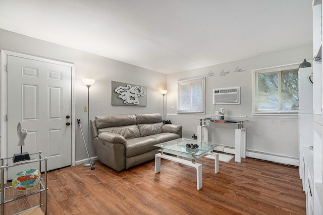 living room with a wall unit AC and hardwood / wood-style floors