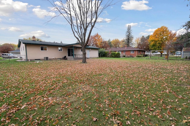 view of yard featuring central air condition unit