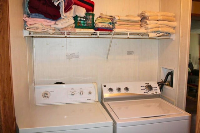 washroom featuring washer and clothes dryer