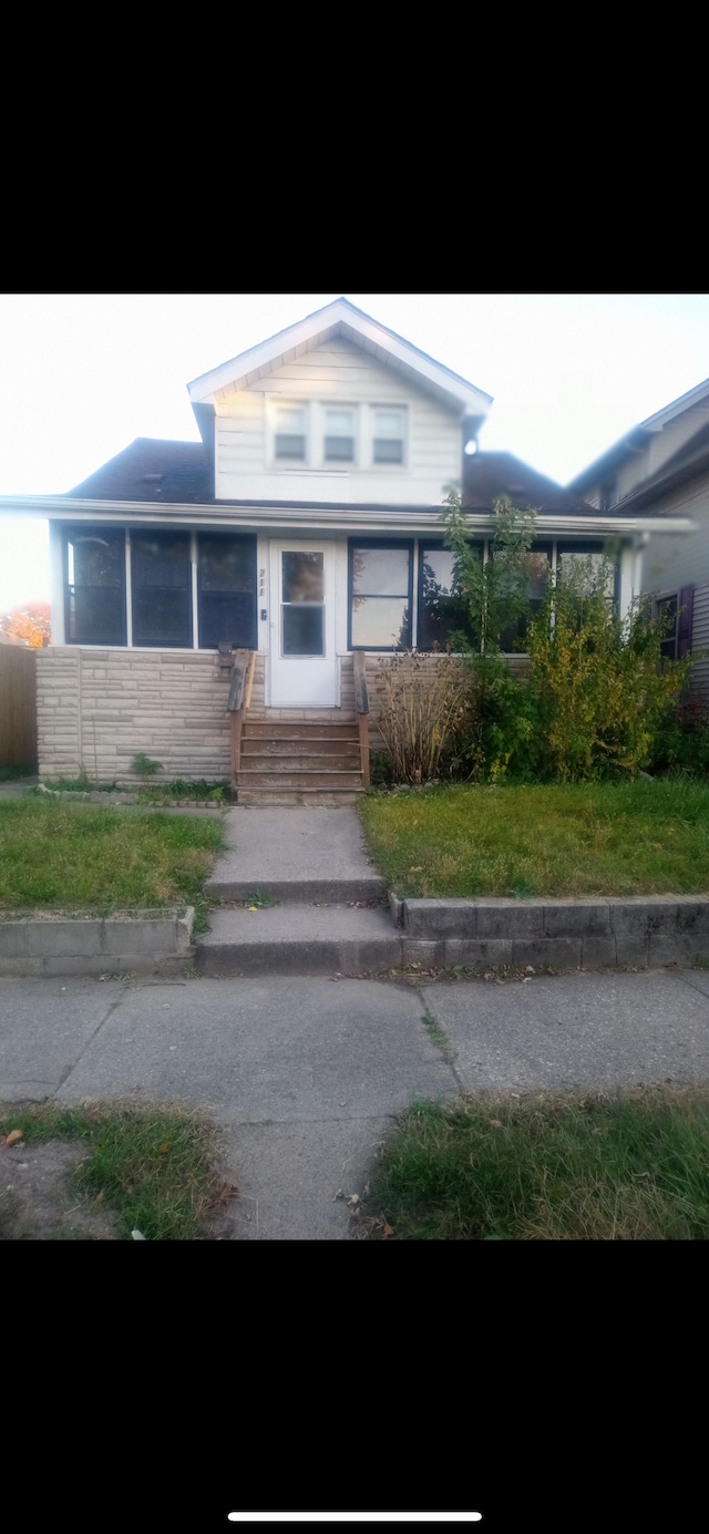 view of front of home with a front yard