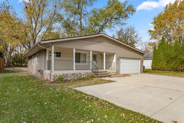 view of front of home with a garage, covered porch, and a front lawn