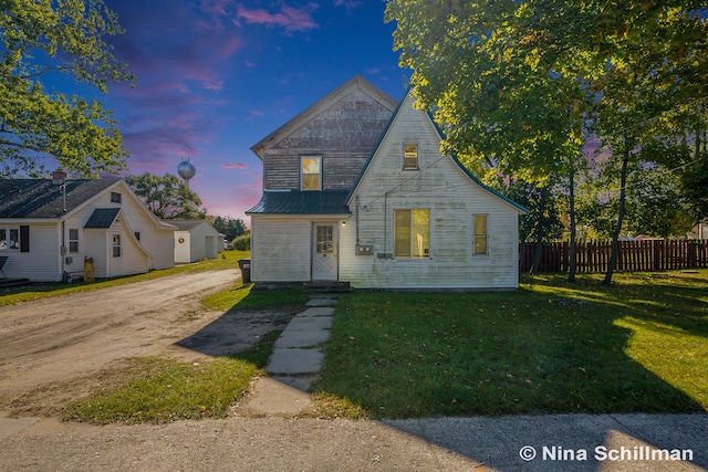 view of front of home with a yard