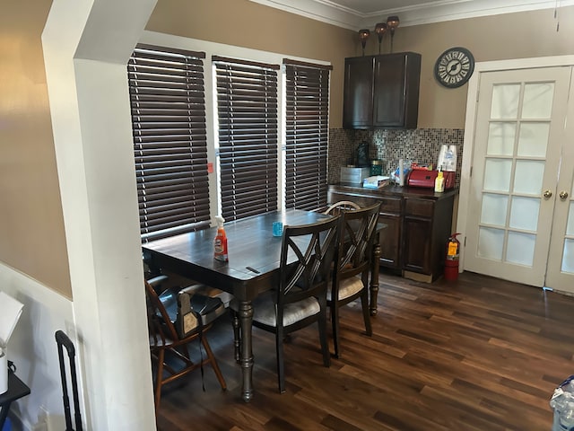 dining room with dark wood-type flooring and ornamental molding