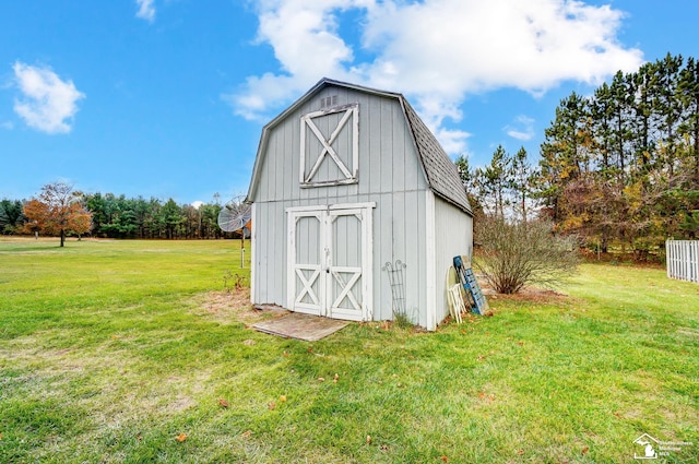 view of outbuilding with a yard