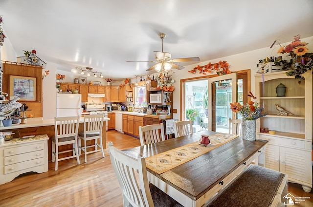 dining space featuring ceiling fan and light hardwood / wood-style flooring