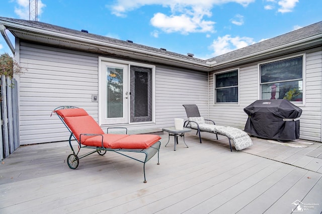 wooden terrace with a grill