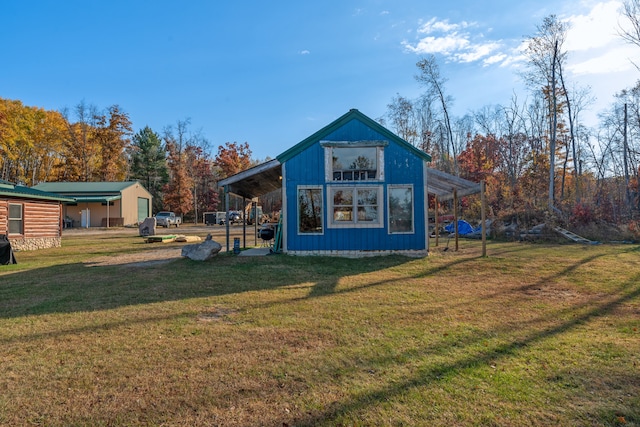 view of outbuilding featuring a lawn