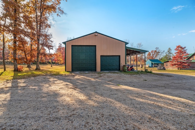 garage featuring a carport