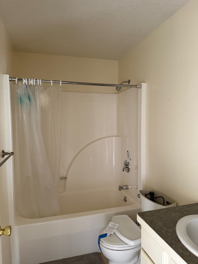 full bathroom featuring shower / tub combo, vanity, and toilet