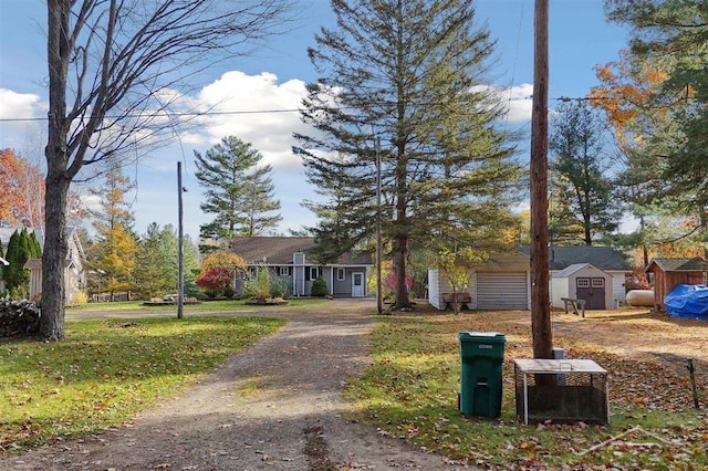 view of front of property featuring a shed