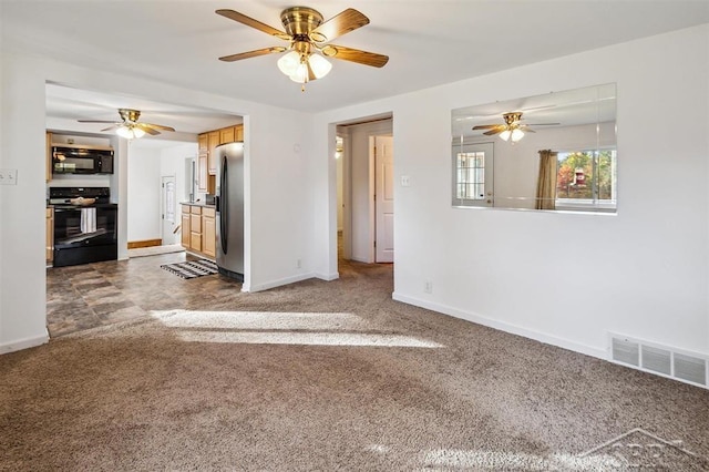 unfurnished living room with carpet and ceiling fan