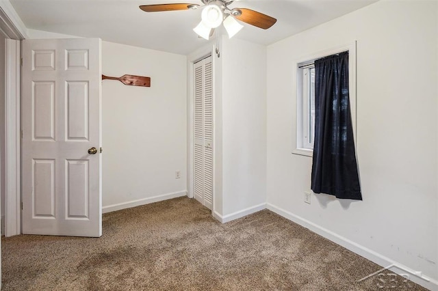 unfurnished bedroom with ceiling fan, carpet floors, and a closet