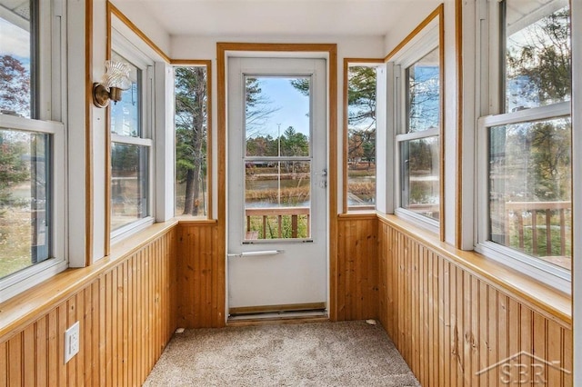 unfurnished sunroom with plenty of natural light