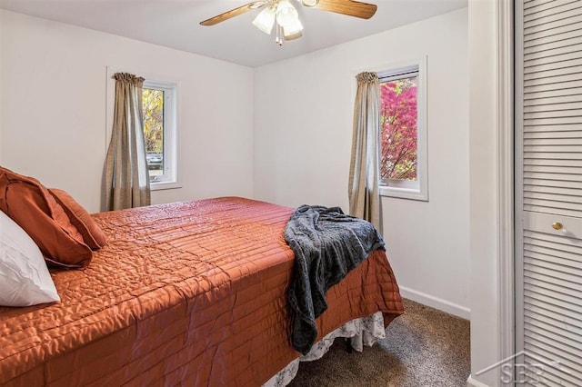 carpeted bedroom featuring ceiling fan