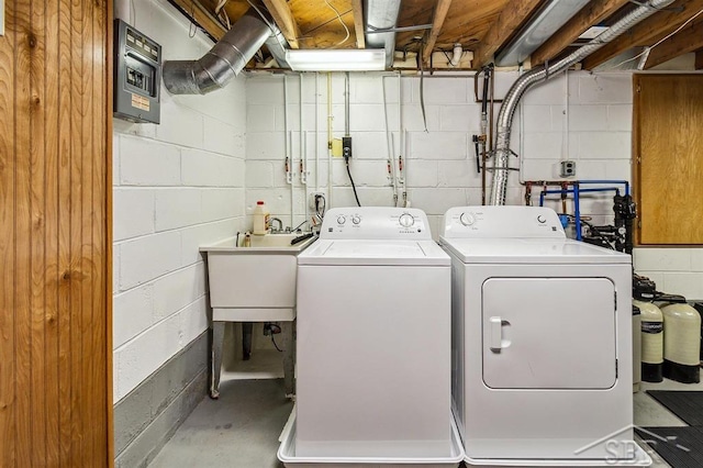 laundry room featuring separate washer and dryer and sink