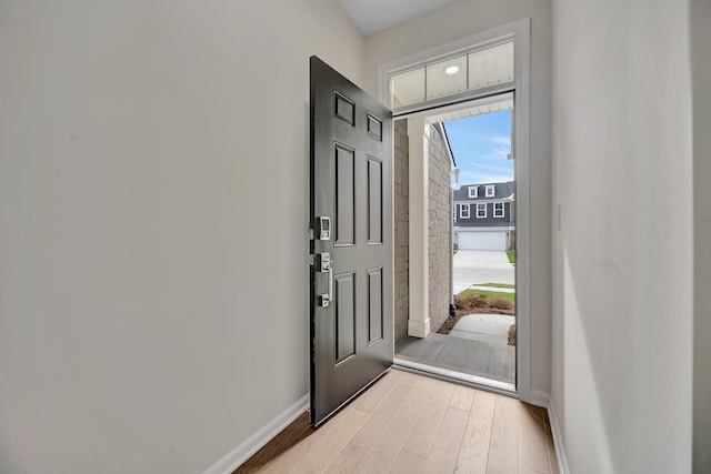 entryway with light hardwood / wood-style floors