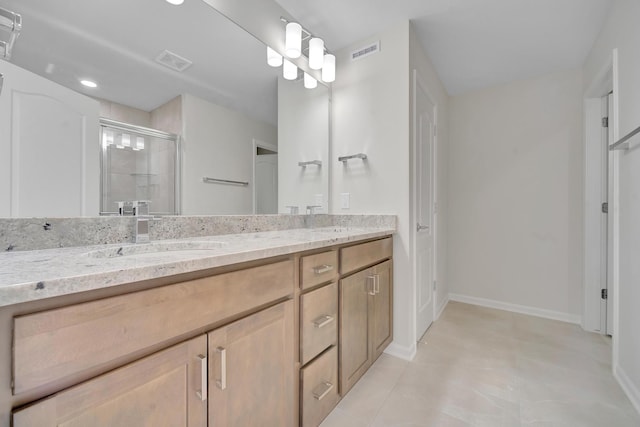 bathroom featuring visible vents, a sink, double vanity, and a stall shower