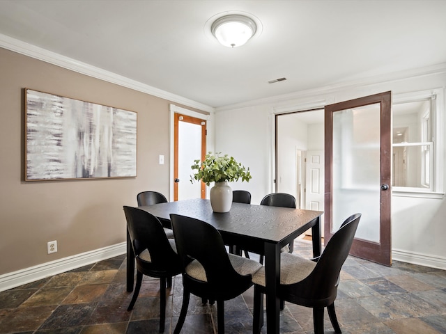 dining room with crown molding and french doors