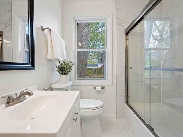 full bathroom featuring vanity, toilet, and enclosed tub / shower combo