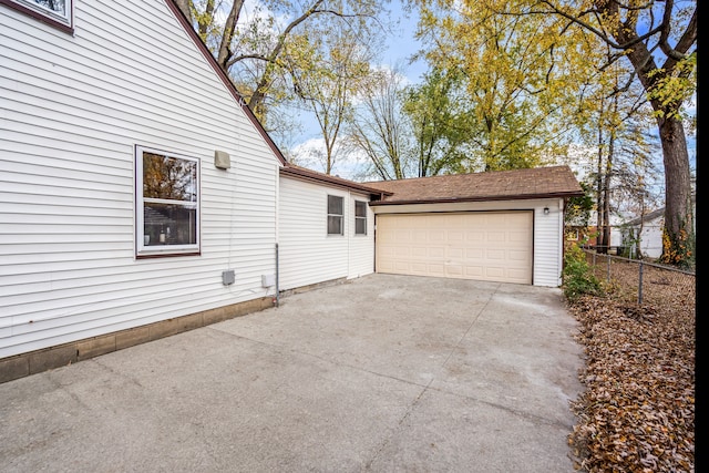 view of side of home with a garage