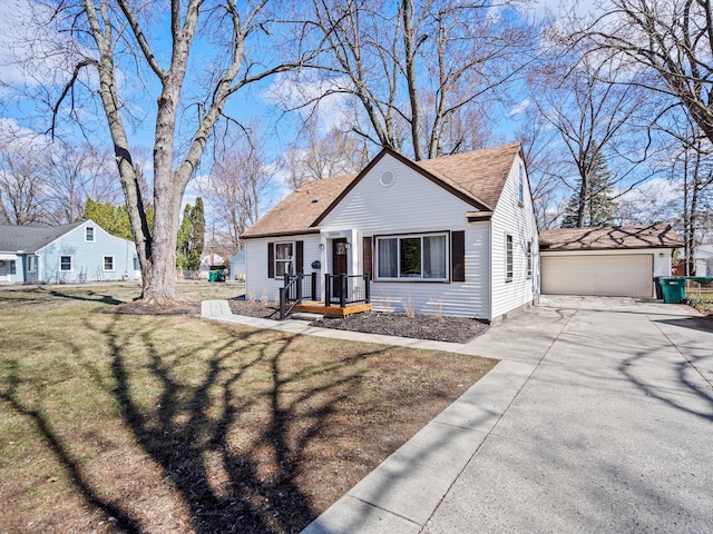 23096 Hawthorne St, Farmington, MI 48336 - bungalow-style house with a front yard, a shingled roof, and a detached garage