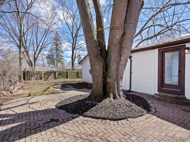 23096 Hawthorne St, Farmington, MI 48336 - view of patio with an outdoor fire pit and fence