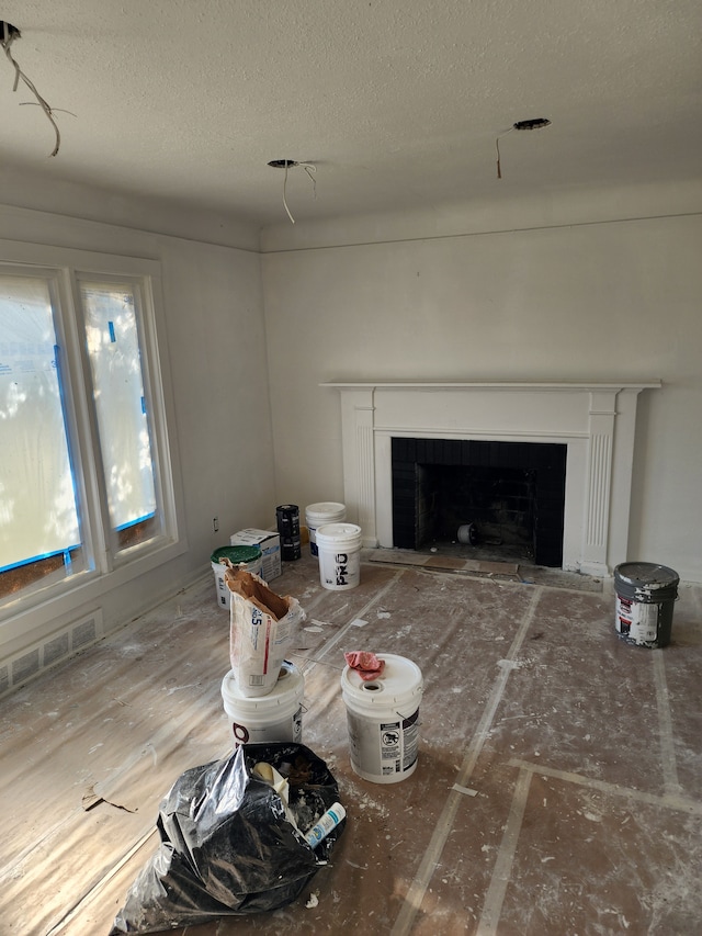 living room with a textured ceiling