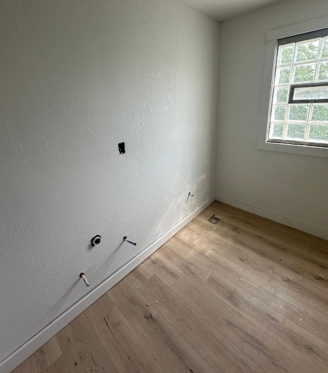 unfurnished room featuring light hardwood / wood-style floors