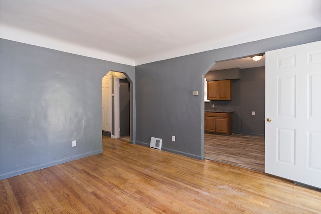 spare room featuring light hardwood / wood-style floors