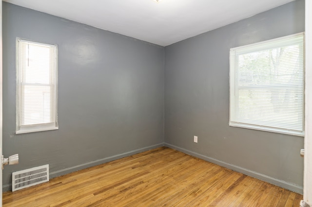 unfurnished room with light hardwood / wood-style flooring