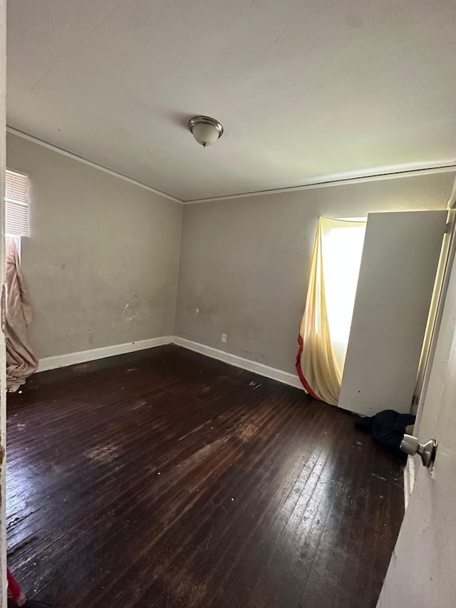 empty room featuring dark hardwood / wood-style flooring