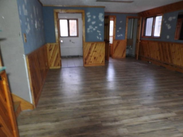 interior space featuring wood walls and dark hardwood / wood-style flooring