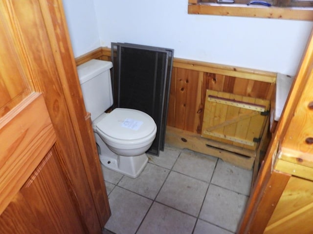 bathroom featuring tile patterned flooring and toilet