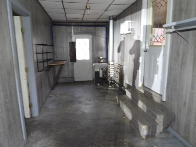 basement with a paneled ceiling