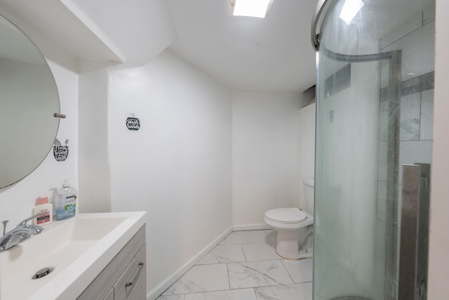 bathroom featuring vanity, toilet, and walk in shower