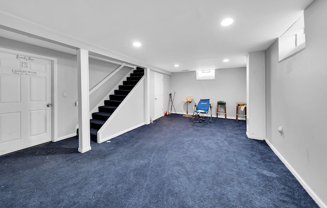 basement featuring dark carpet