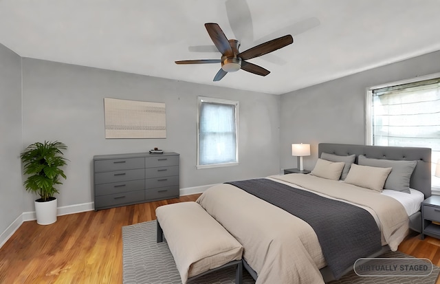 bedroom featuring light hardwood / wood-style flooring and ceiling fan