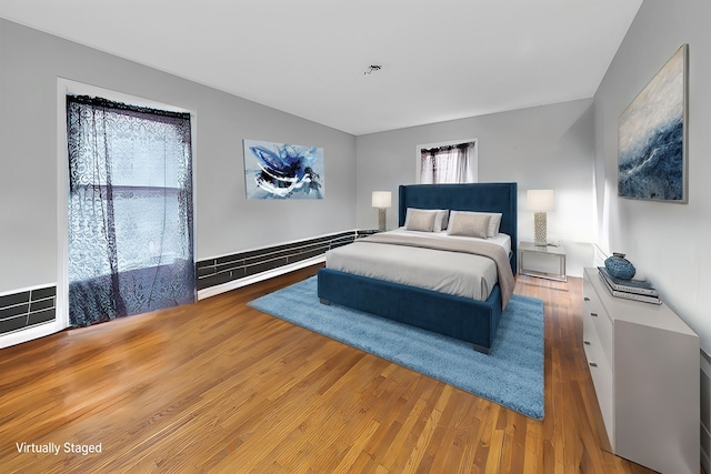 bedroom featuring wood-type flooring