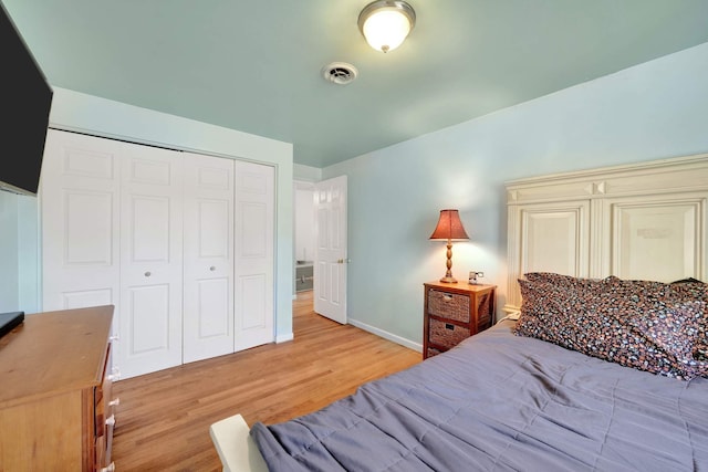 bedroom with a closet and light wood-type flooring