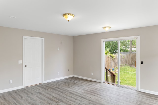 spare room featuring light hardwood / wood-style flooring