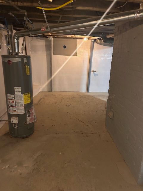 basement featuring water heater